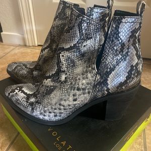 Snake skin pattern boots. Never worn. Size 8.5.